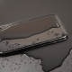 Phone on table covered in water